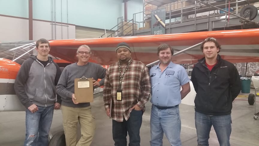 Photo: Awarding the acceptance paperwork. Left to right: Tony Dopita, Assembly Forman; Randy Schlitter, CEO RANS Designs; Derrick Jones, FAA; Ed Schwab, RANS Designs Aircraft Technical Specialist; Sheldyne Brown, RANS Designs Assembly Specialist