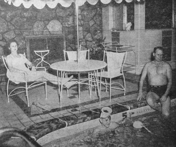 Veda relaxes in a lawn chair by the family pool. J.E. seems to be considering whether to try it across the pool just once more or call it a day, and Steve, who is always the last one out, continues to covort around in the water. J.E., once a swimming instructor, considers the indoor pool which he and Veda built, to be one of the greatest assets toward a longer, healthier life.