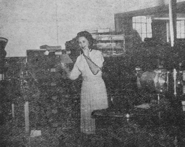 Veda Dyer, secretary of Univair and general manager of the propeller shop. Known to friends and employees alike by her first name, Veda, looks up the case history of a prop for a customer calling long distance.