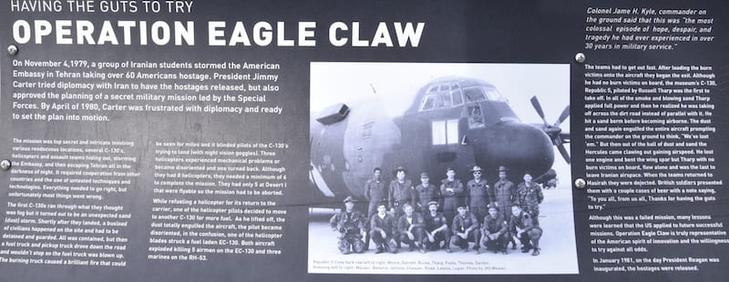 The display board in front of the Lockheed C-130 Hercules tells the story of Operation Eagle Claw, the unsuccessful April 1980 mission launched to try and free 52 U.S. hostages held in Iran.