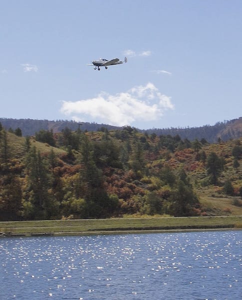 Low and fast: The finish line was at Capote Lake, a park owned and operated by the Southern Ute Tribe. The Tribe arranged for the park to be cleared and the finish line was placed more than 500 feet way from finish line judges and timers. During the briefing, pilots were told to fly as low as they liked, but not to dip their wings in the water. According to the GPS flight log onboard, Race 53 crossed the finish line at 83 feet AGL. Racer William E. Dubois was shooting for 53 feet, but ending up needing to hold some extra altitude to clear the ridges on the other side of the lake. Judges told the racer that the local children watching the finish particularly liked his combined pull up and wing wag. (Photo by Lisa F. Bentson)