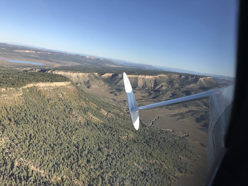 The Pagosa Springs 160 Sport Air Race is flown along the edge of the mountains and out onto the high mesa lands of southwestern Colorado and northwestern New Mexico. This is a cockpit view of the right tail of Tail End Charlie during the race. (Photo by William E. Dubois)