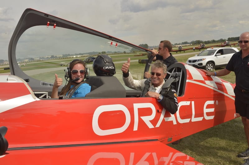 Young Eagles Chairman Sean D. Tucker gives a Young Eagle her first flight at Oshkosh 2013.