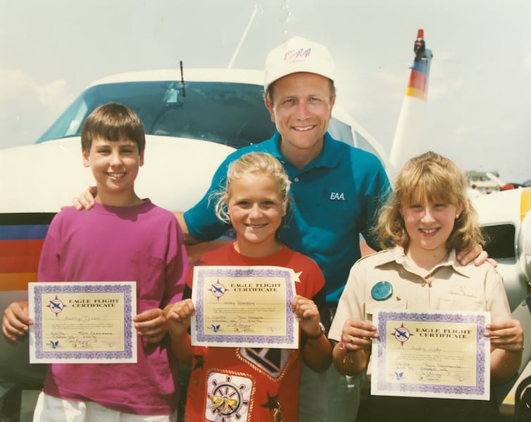 The first Young Eagles Kenny Tason, Lesley Poberezeny, and Audra Judy with then EAA President Tom Poberezeny