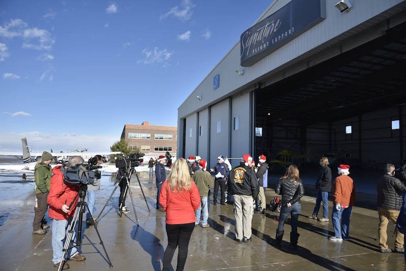A weather briefing for pilots of the Airlift, led by Metropolitan State University of Denver’s Precision Flight Team Captain, Blake Moore, in front of Signature Flight Support at KAPA