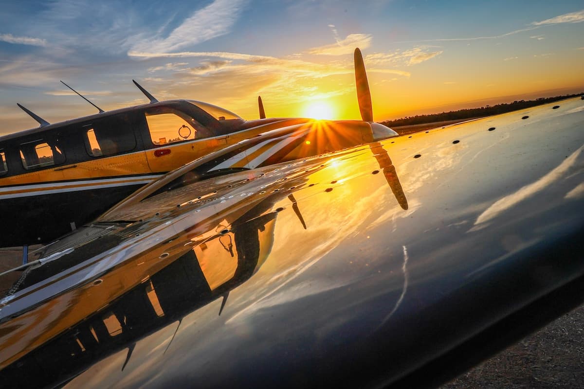 Beechcraft B58 Baron parked on the ramp during sunrise at Bartow Executive Airport in Florida.