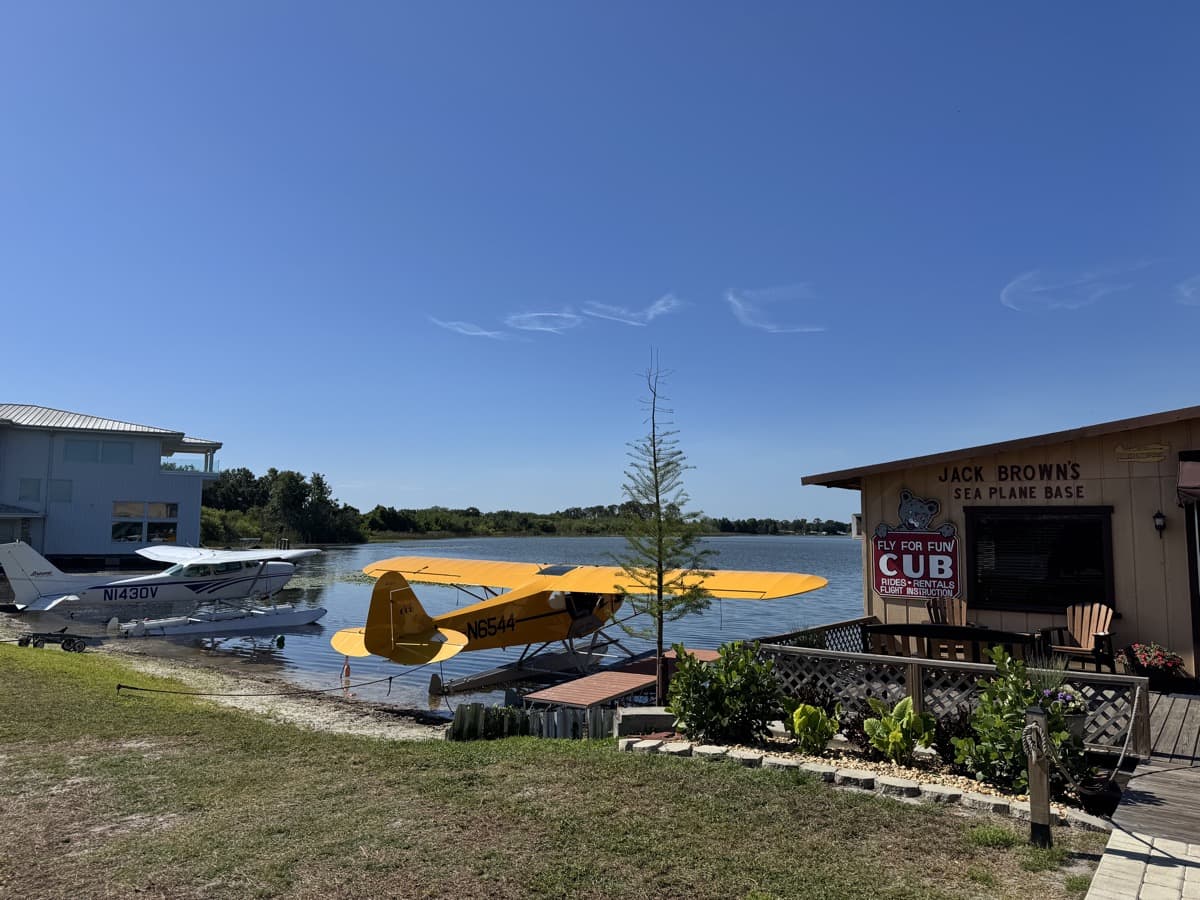 Cessna 172 and Piper Cub floatplanes docked at Jack Brown's Seaplane Base in Winter Haven, Florida