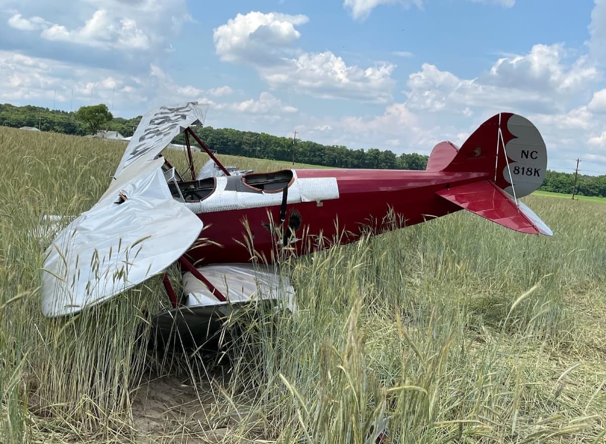 Wreckage of a Great Lakes 2T-1 biplane resting in a field following an aerodynamic stall accident.