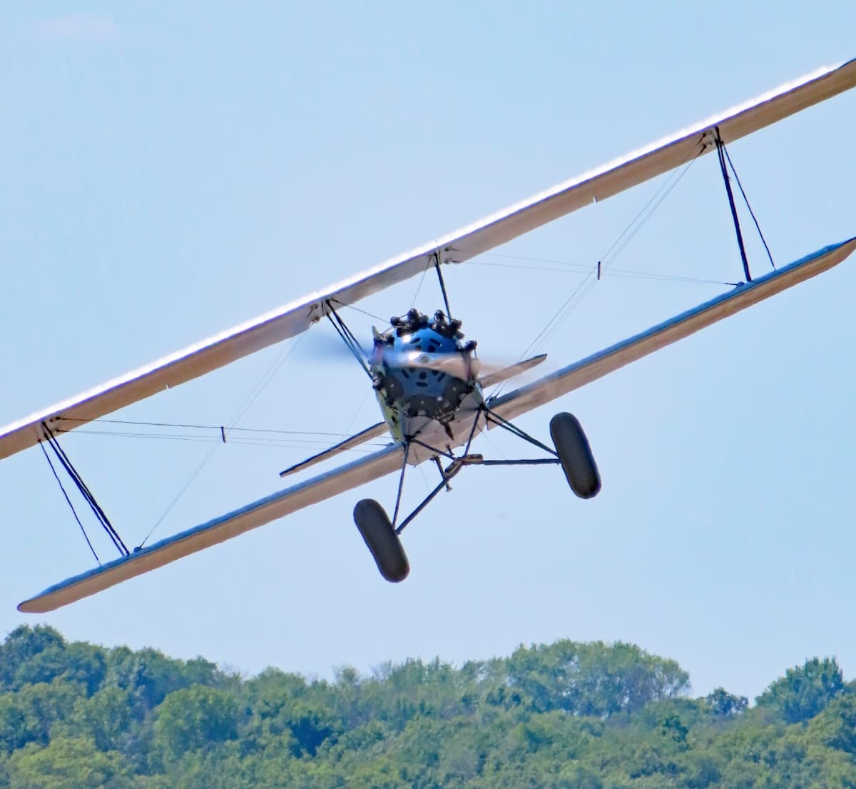 Chris Price flying his 1929 Curtiss-Wright Travel Air 4000 antique biplane at Le Sueur Municipal Airport.