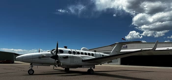 A Beechcraft Super King Air aircraft on the ramp at Fourth Front Aviation Colorado.