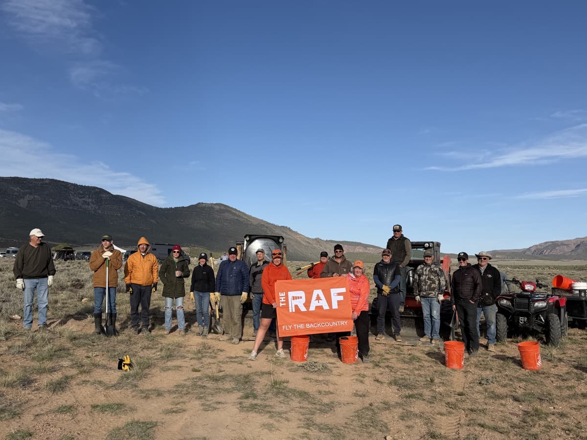 Volunteers pose at Taylor Flat Airstrip during the backcountry airfield restoration work party.