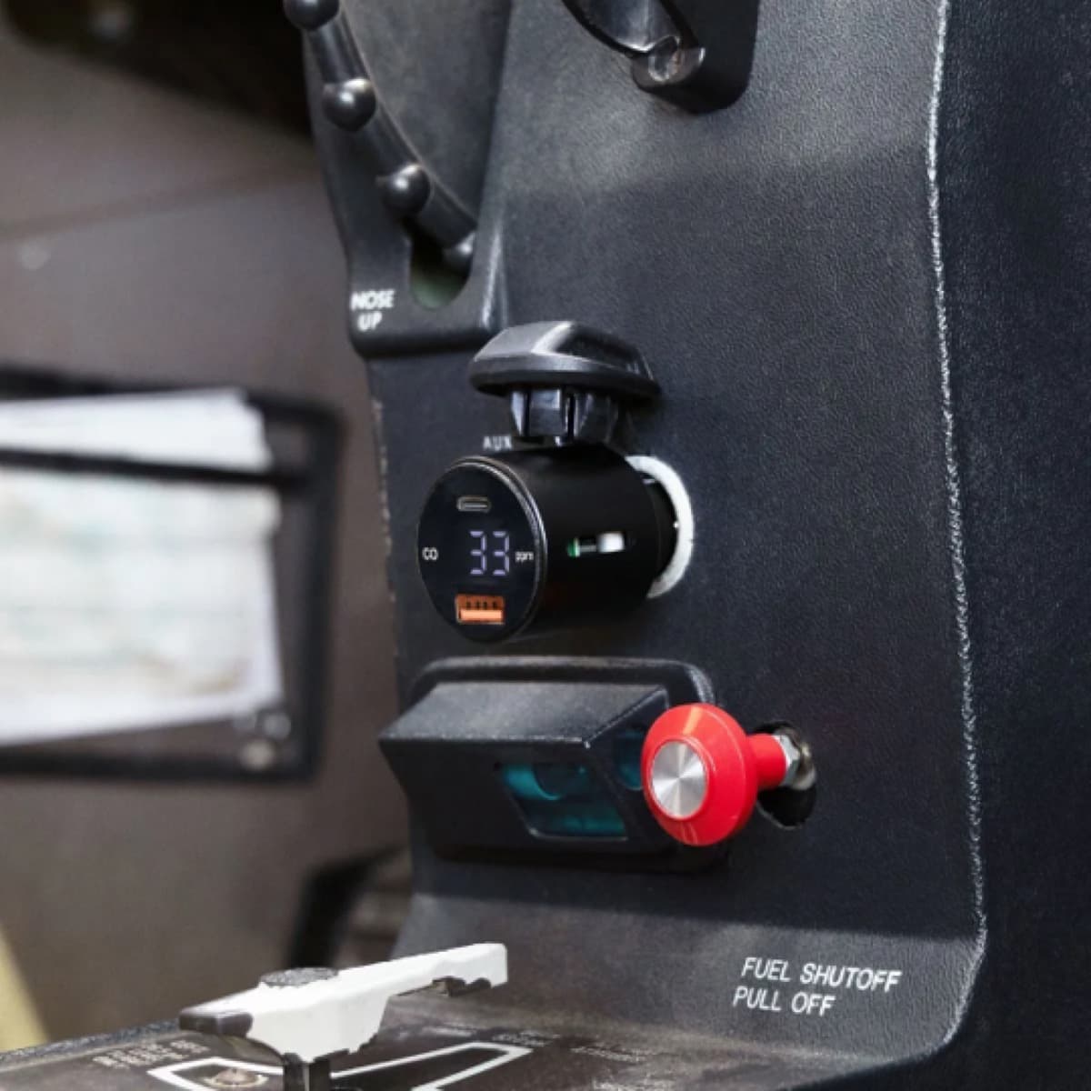 Sporty's Flight Gear Carbon Monoxide Detector Charger plugged into an aircraft accessory port showing a real-time CO reading.